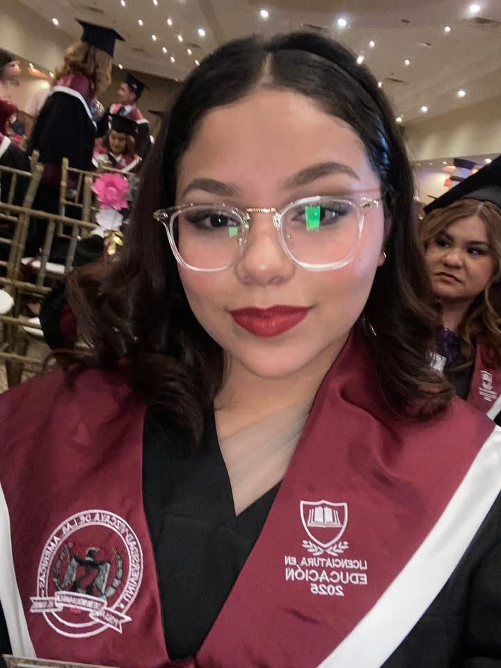 Ambar smiling in her school uniform
